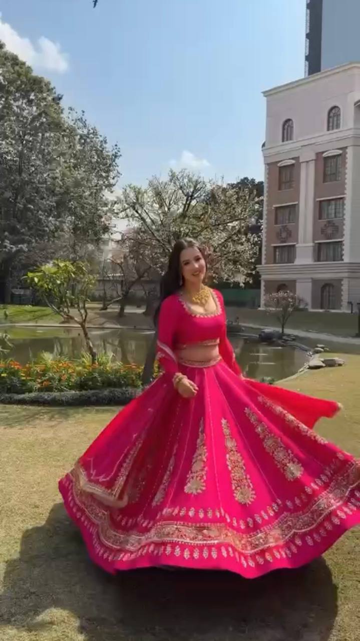 Radiant Rani Pink Silk Lehenga Choli Adorned with Opulent Heritage Floral Motifs and Intricate Zari Borders